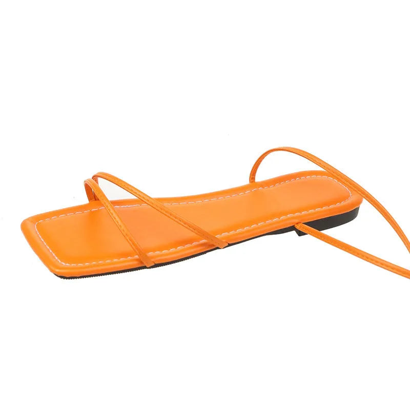 Women's flat sandals with ankle bandage cloth detail and front lace-up fastening