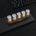 RGB LED digital clock showing colourful display modes with USB cable connection