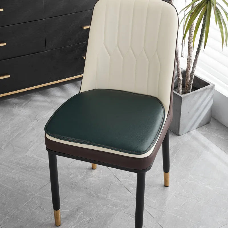 Leather horseshoe-shaped seat cushion in beige, showing non-slip base and thick padding.