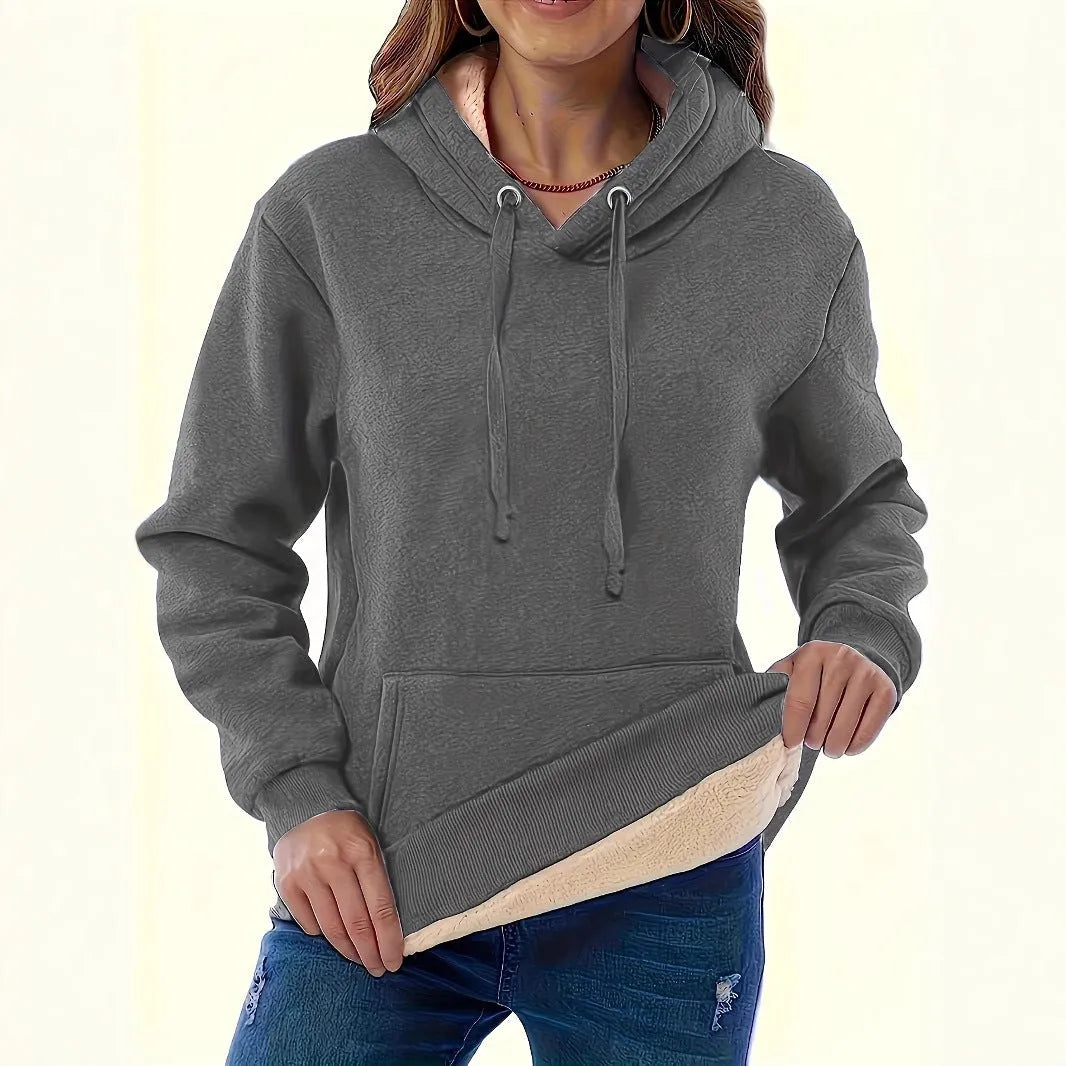 Women's thick grey hooded sweater with a 3D pattern and front pockets on a hanger.
