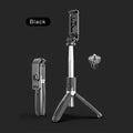 Black stainless steel Bluetooth selfie stick tripod extended with phone attached, showing wireless remote.