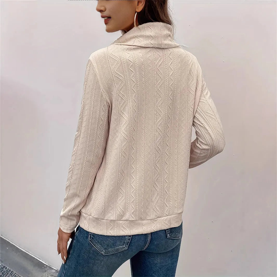 Apricot coloured hooded pullover sweater with long sleeves and a drawstring on the hood.