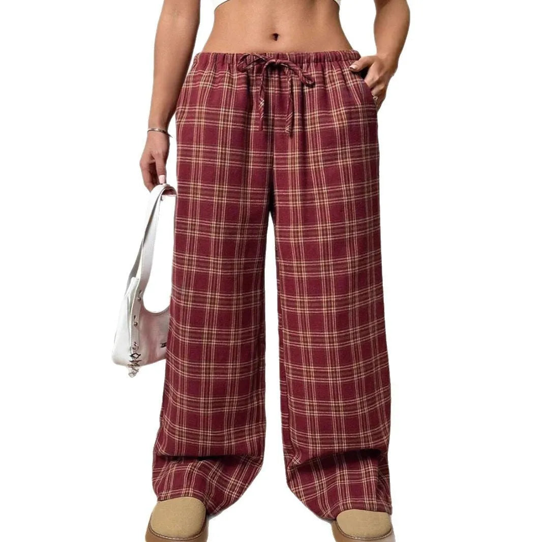 Women's loose fit plaid trousers with drawstring waistband and side pockets in blue colour