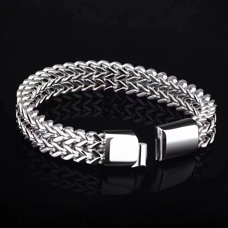 Silver geometric stainless steel men's bracelet showing front and back design details