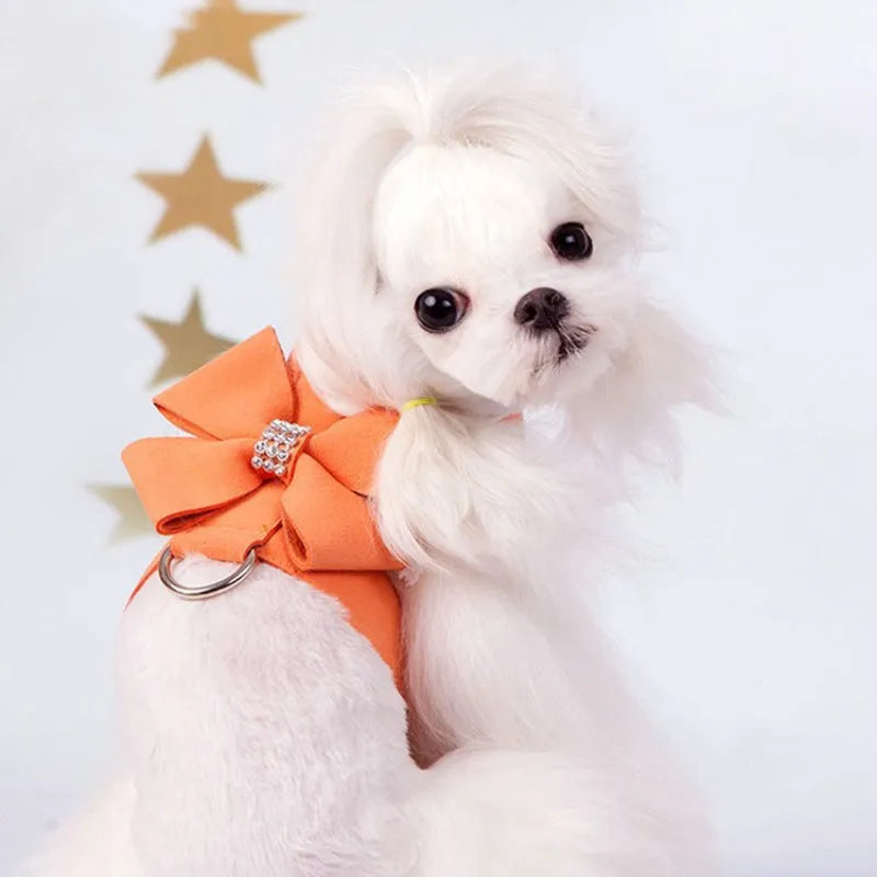 Adjustable puppy chest strap with bowknot design in microfiber material showing pink blue orange colour options