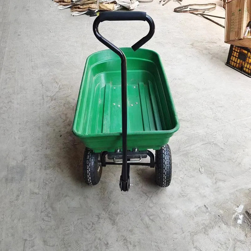 Green four-wheel plastic and steel dump truck with load bed, model TC2145