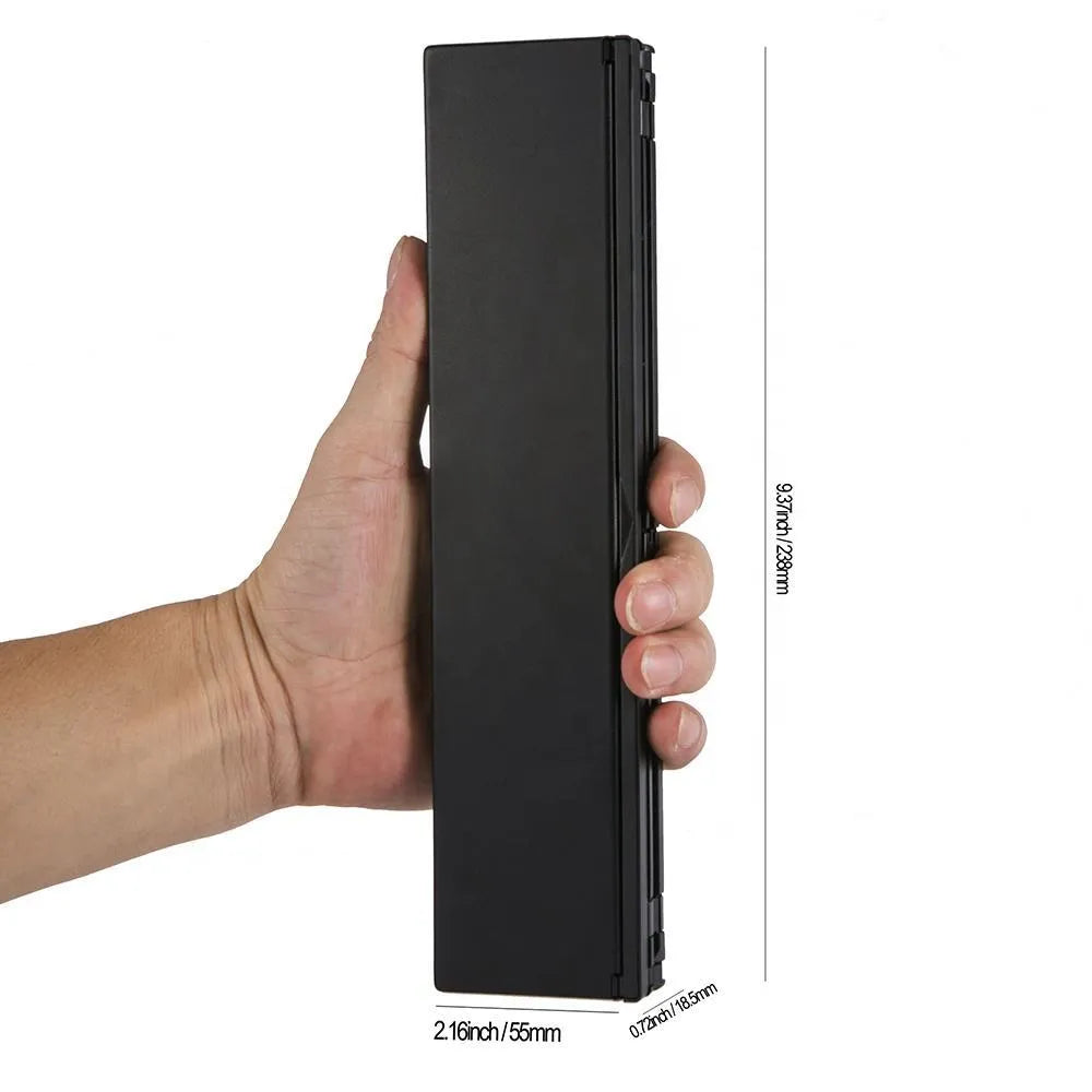 Black folding wireless Bluetooth keyboard for tablets with aluminium bottom and wrist support