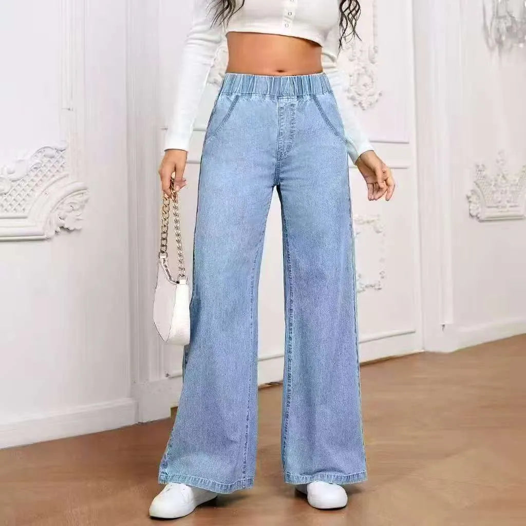 Plus size light blue washed wide-leg denim jeans on a hanger, showing straight leg cut.