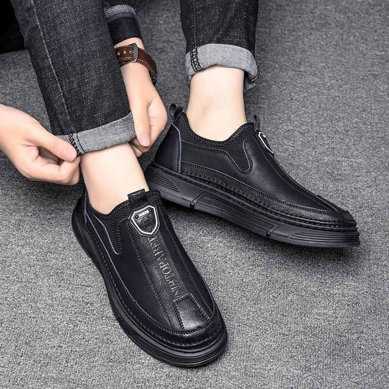 Men's solid colour casual leather shoes with round toe in black and brown options.
