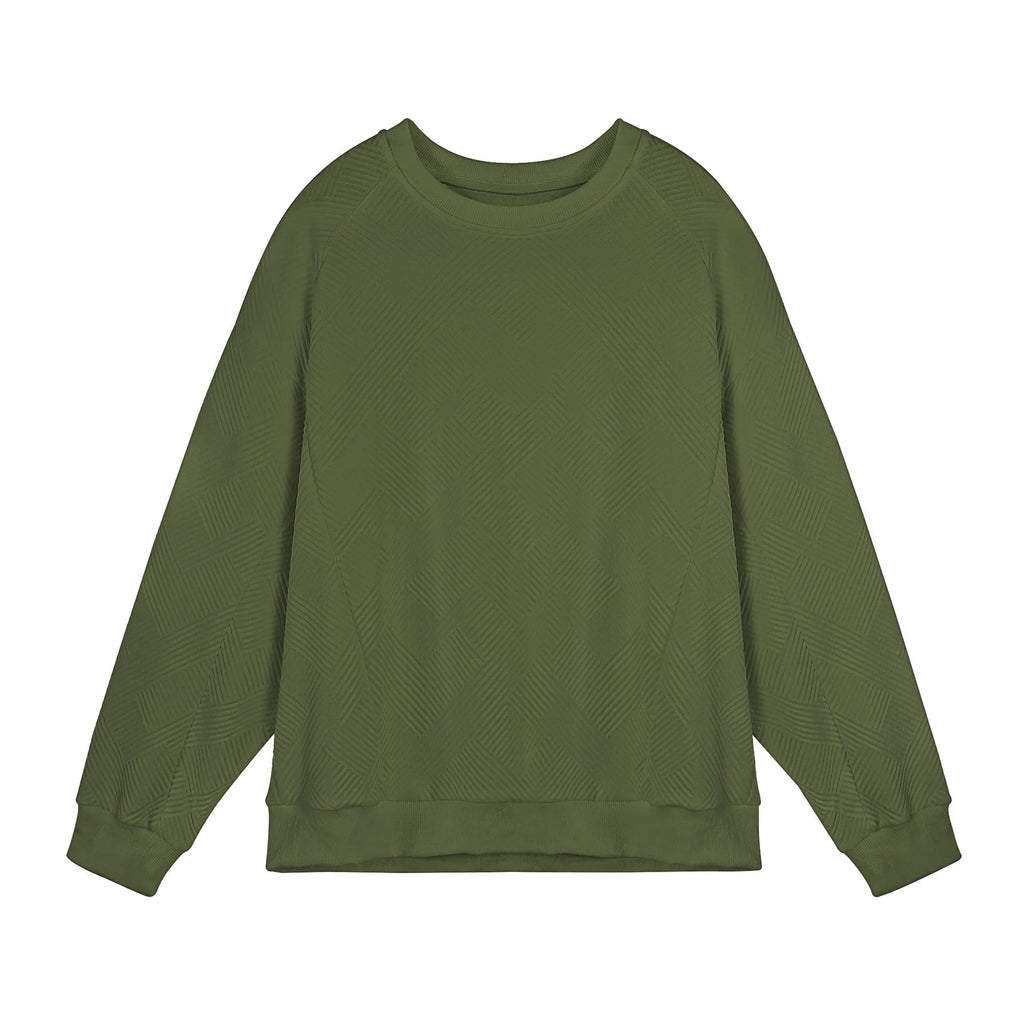 Man wearing a loose-fit, long-sleeved twill jacquard sweater in a solid colour with a round neck.