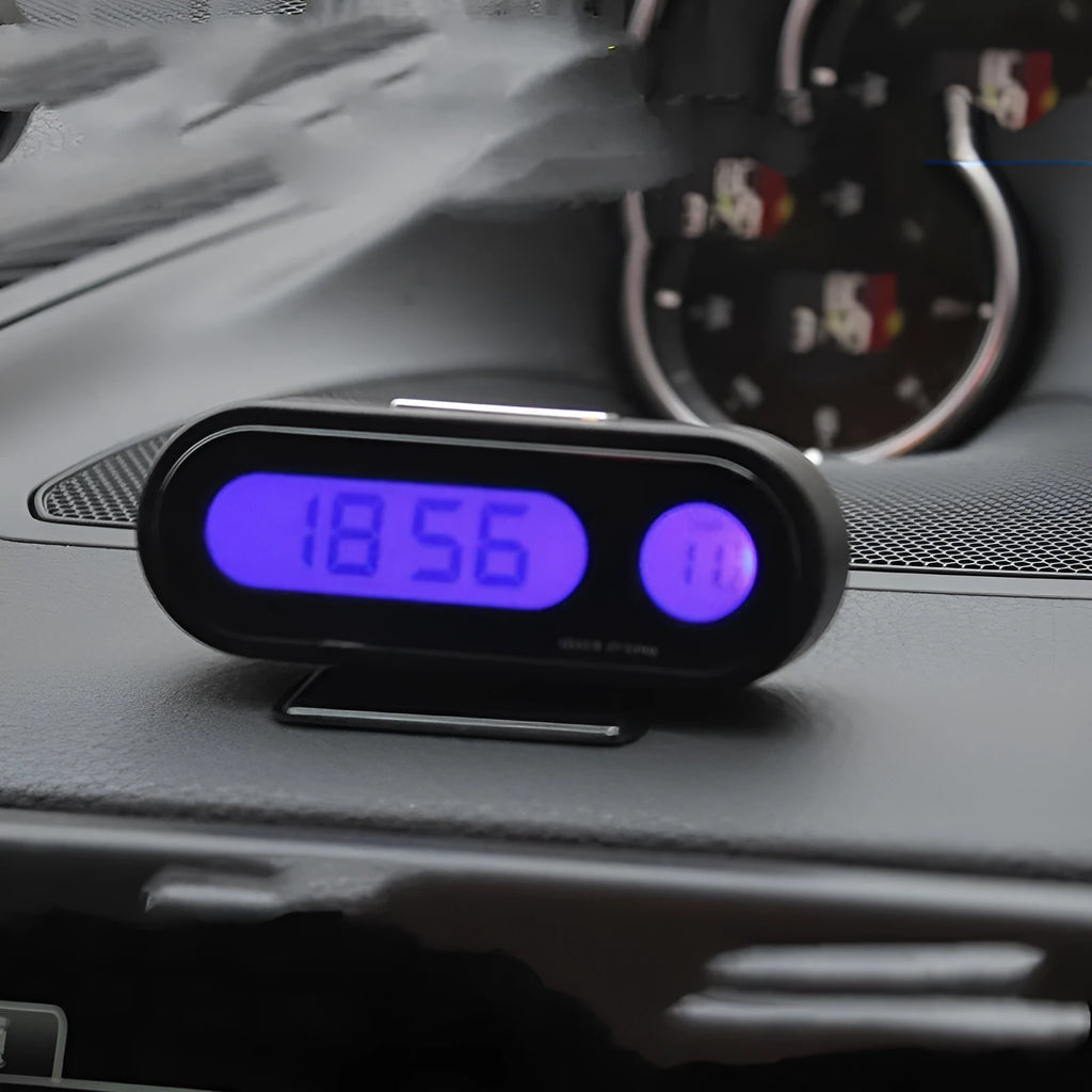 Black car electronic clock thermometer with digital LED display showing time and temperature