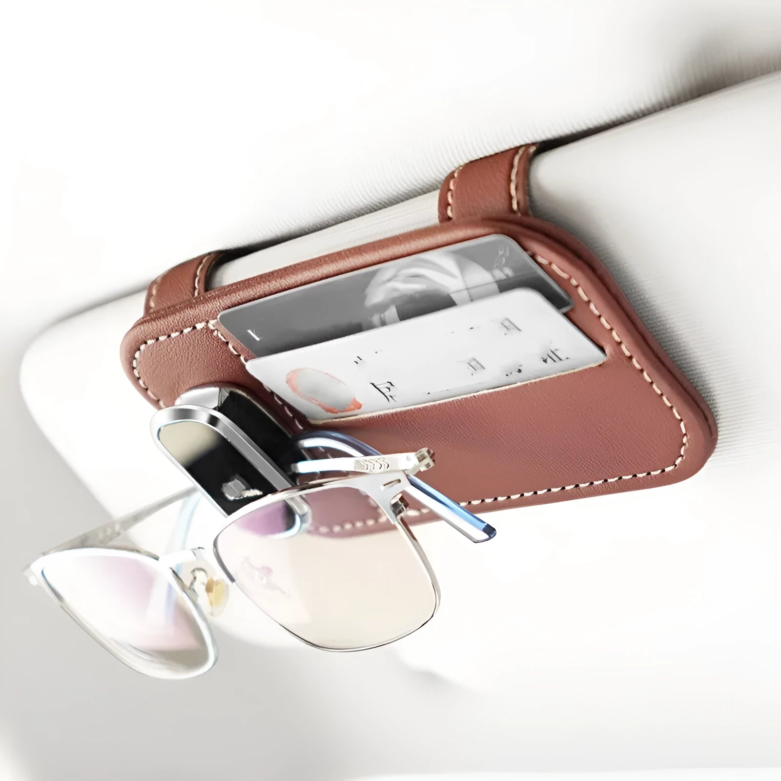 Cowhide leather car sun visor holder with card slots and integrated sunglasses clip.