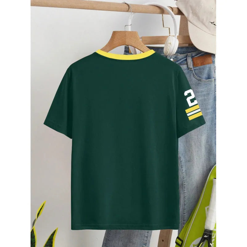 Man's loose fit red cotton t-shirt with a digital print of contrasting green letters on the front.