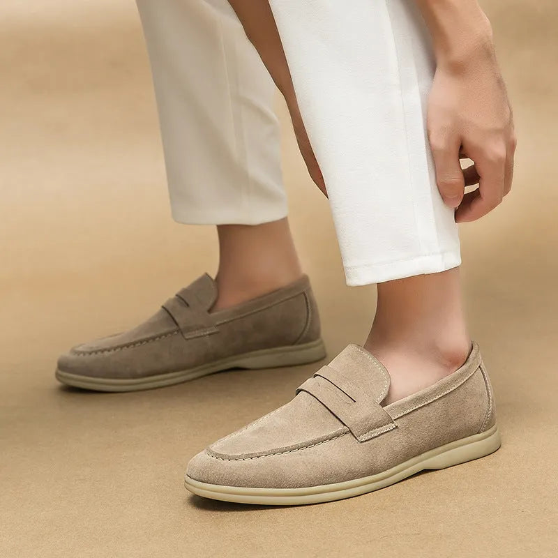 Men's black slip-on leather casual shoes with round toe and a mid-height rubber sole.