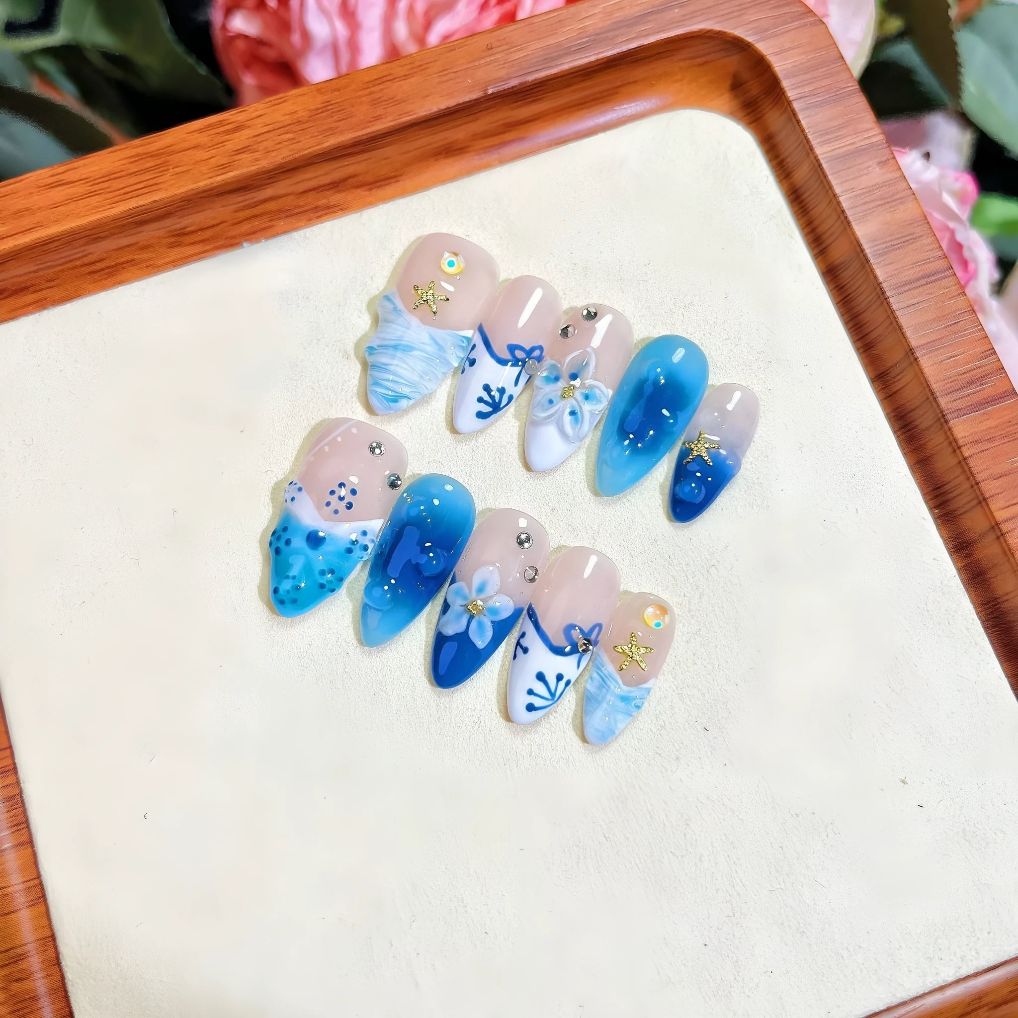 Blue hand-painted carved summer ice transparent plastic fake nails set in sizes XS, S, M, L