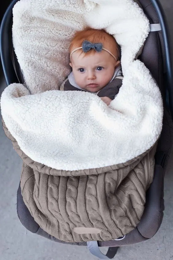 Baby stroller sleeping bag with thick filling in envelope design, shown in beige colour.