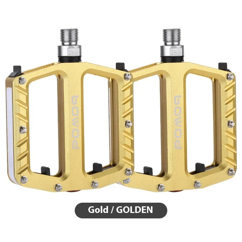 Pair of aluminium alloy bicycle pedals with integrated LED lights in a choice of colours.