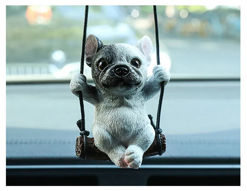 Resin cartoon bulldog car hanging ornament for a rearview mirror in various colours.
