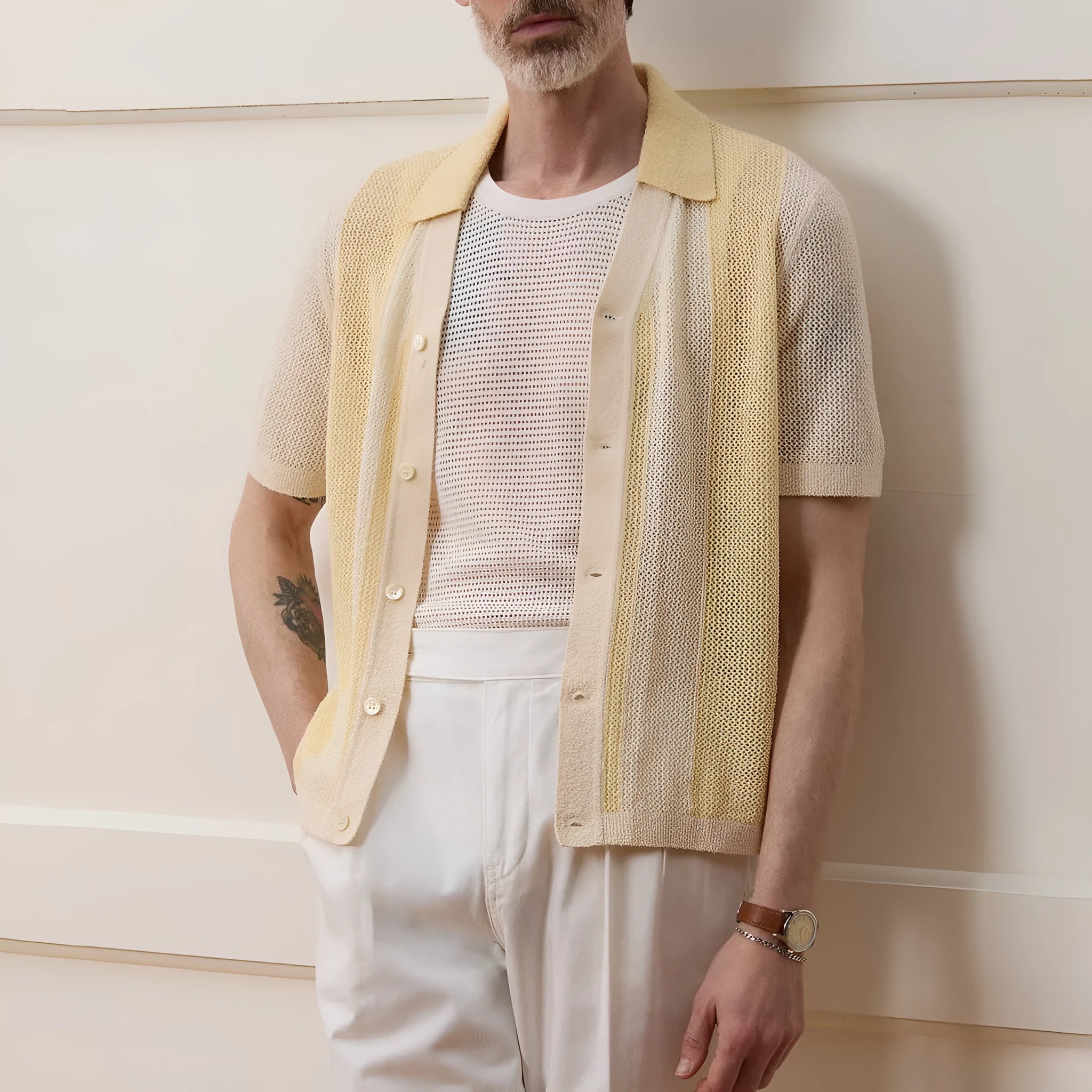 Yellow men's polo shirt with hollow-out knit design and asymmetric details in Tencel fabric