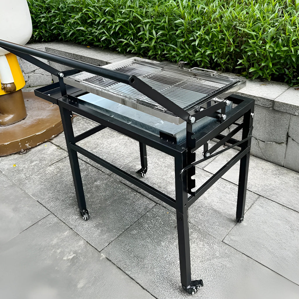 Large foldable and detachable charcoal BBQ grill oven set up in an outdoor courtyard setting.