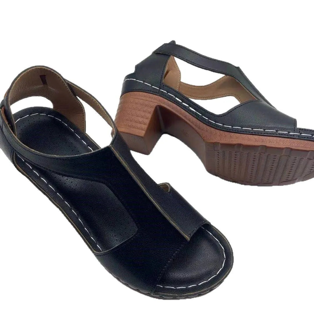 Women's beige peep toe wedge sandals with an adjustable ankle buckle strap on a foot.