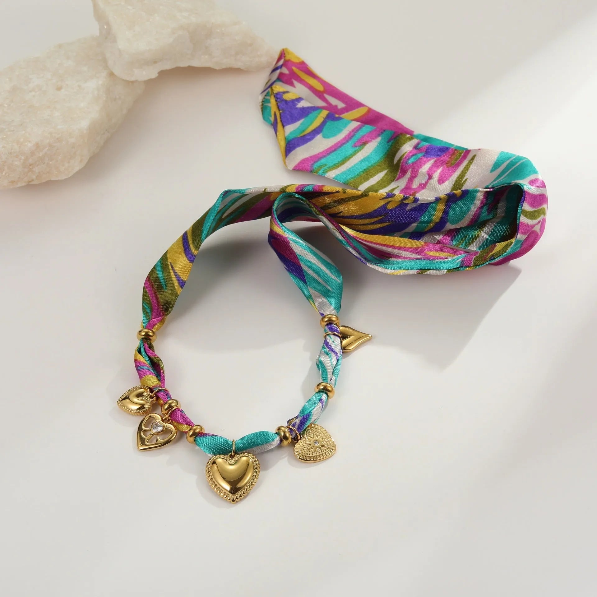 Stainless steel geometric chain jewellery with 18K electroplated finish, available as necklace or bracelet