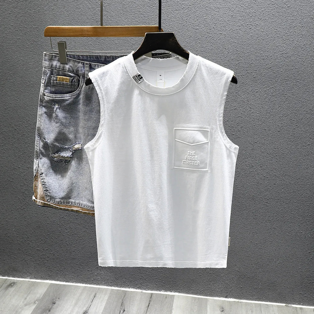 A man's solid black cotton sleeveless t-shirt with a loose fit and straight hem, laid flat.