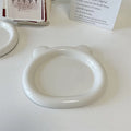 White ceramic plate with bear doodle design, 20cm diameter, on a table.
