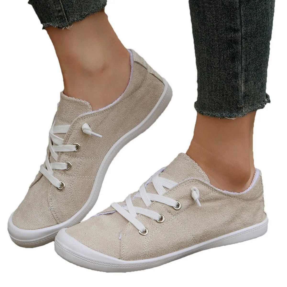 Women's creamy-white beige low-top fabric casual sneakers on a wear-resistant rubber sole.