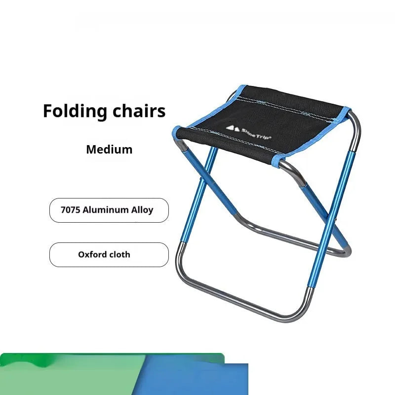 Black ethnic style aluminium alloy folding camp stool shown folded and unfolded.