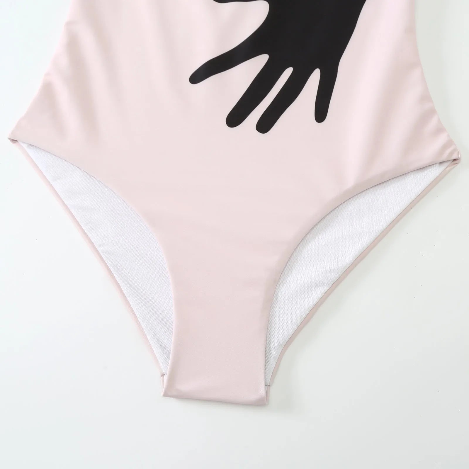 Women's one-piece bikini swimsuit with an attached white tulle skirt.