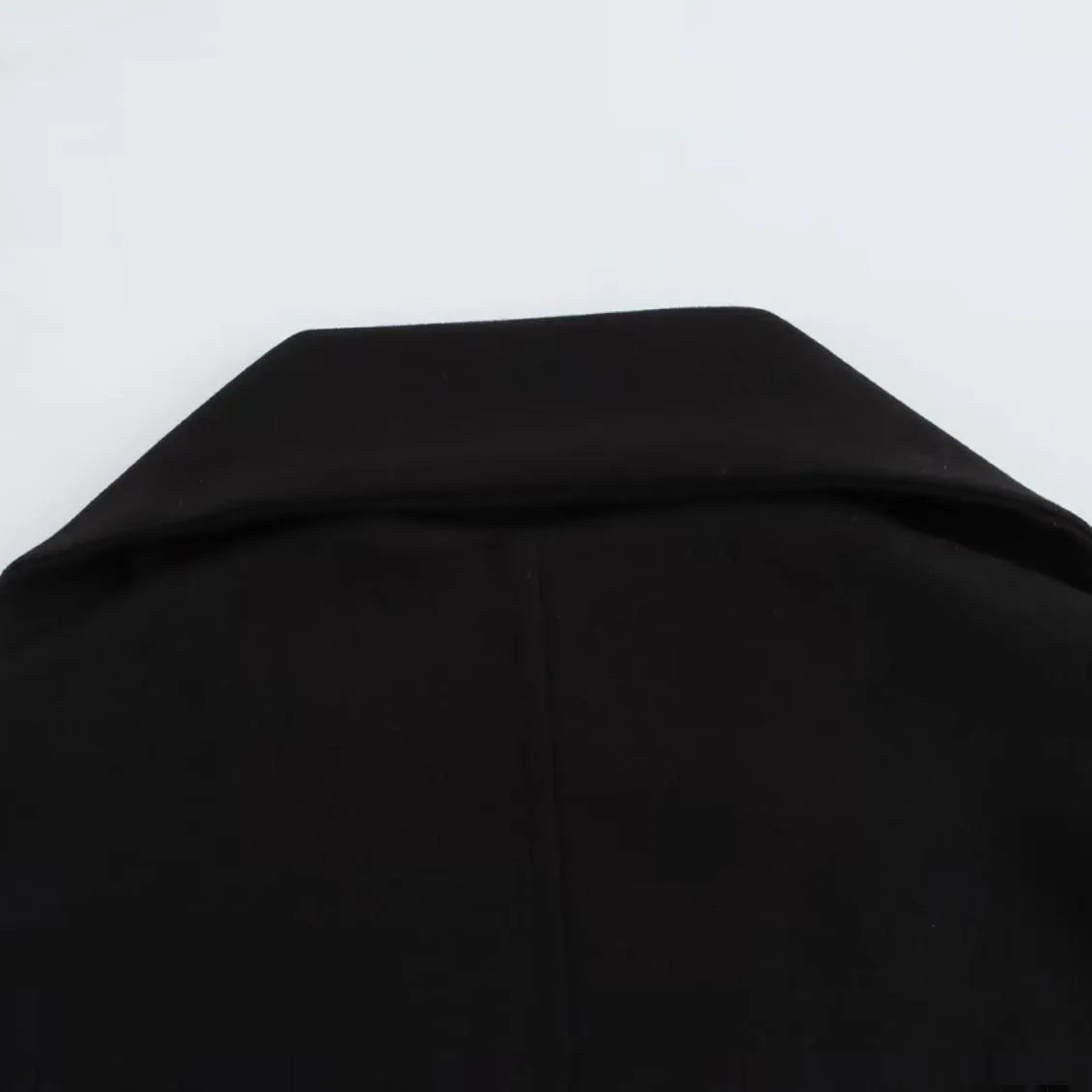 Women's longline street fashion coat with artificial fur collar in lengthened silhouette