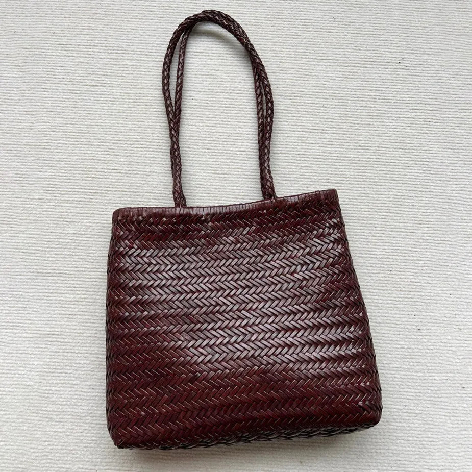 Brown woven leather tote bag with three-dimensional pocket and polyester lining