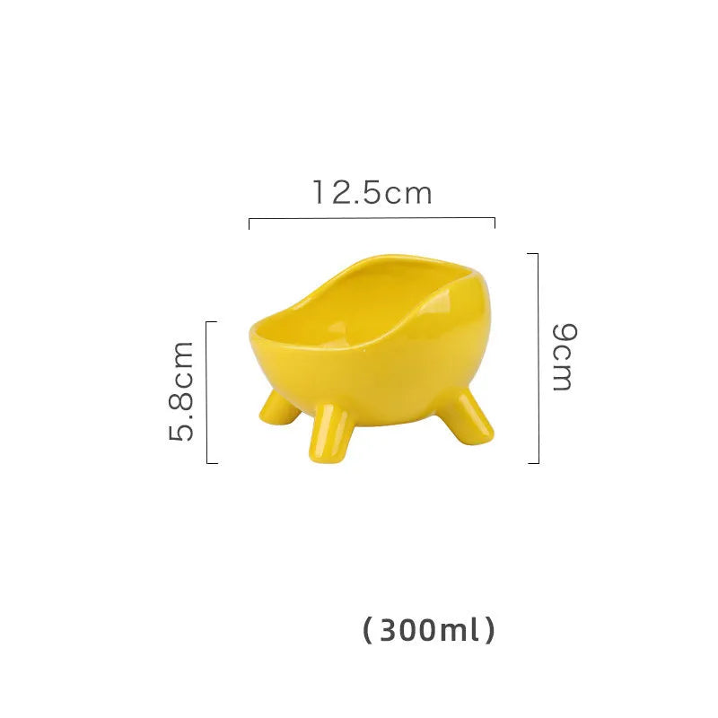Green ceramic cat food bowl with four-legged stability base and wide mouth opening