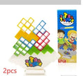 Plastic balance stacking game with 16 coloured building blocks on chassis