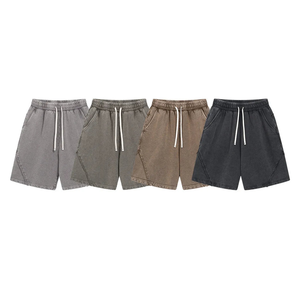 Men's loose-fit retro shorts in batik-washed cotton terry fabric, shown in a batik black colour.