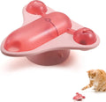 Interactive pet puzzle toy with blue base, a central snack cabin, a bell, and catnip attached. Shows suction cups on bottom.