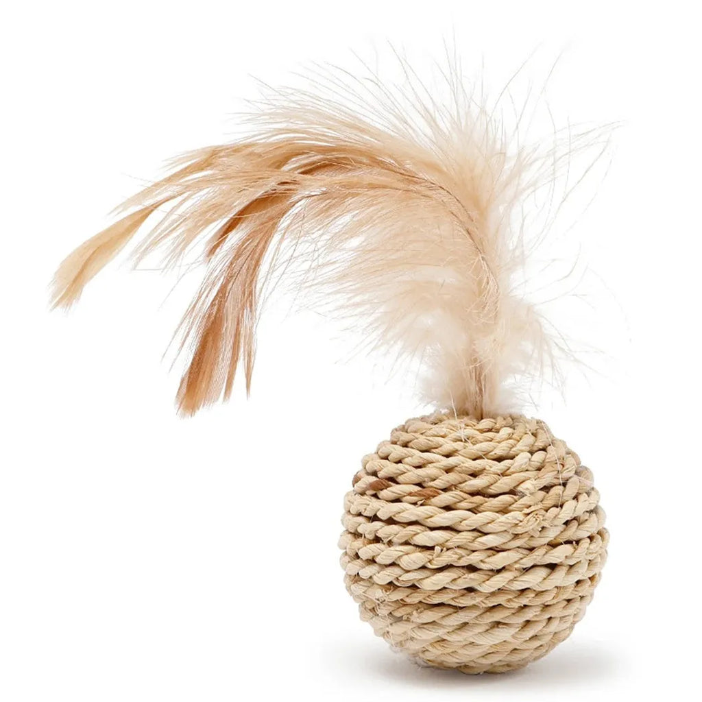 Two cat toy balls: one rattan sphere and one colourful faux feather ball with bell on a neutral background