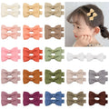 Assortment of pastel coloured baby hair clips and bows with no-slip lining.