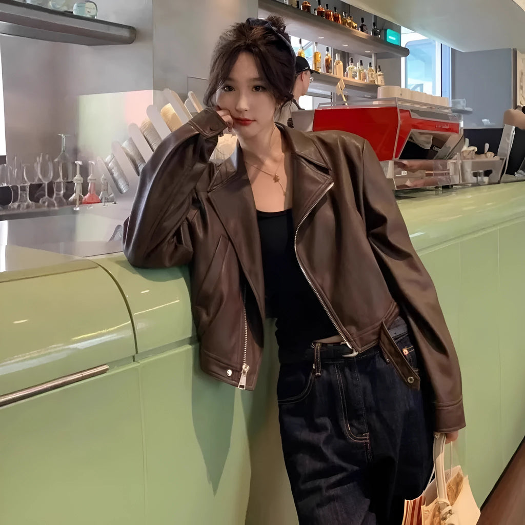 Women's slim fit leather coat jacket in black with long sleeves and pockets