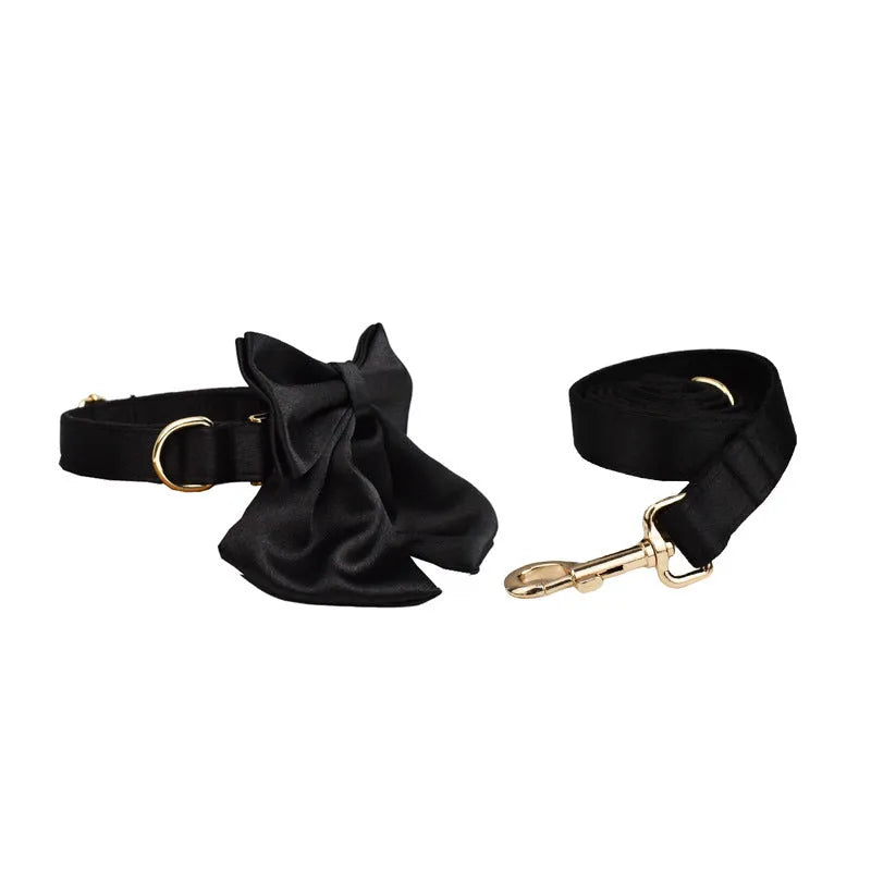 Complete dog accessory set showing collar, rope leash, decorative bow, and vest in coordinating colours