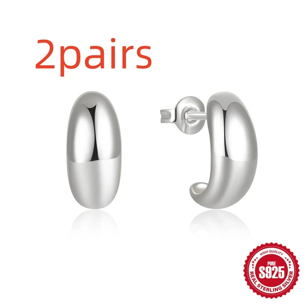 C-shaped sterling silver stud earrings with gold electroplated finish