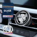Silver magnetic car air vent phone holder with snap-on clip mounted on dashboard vent