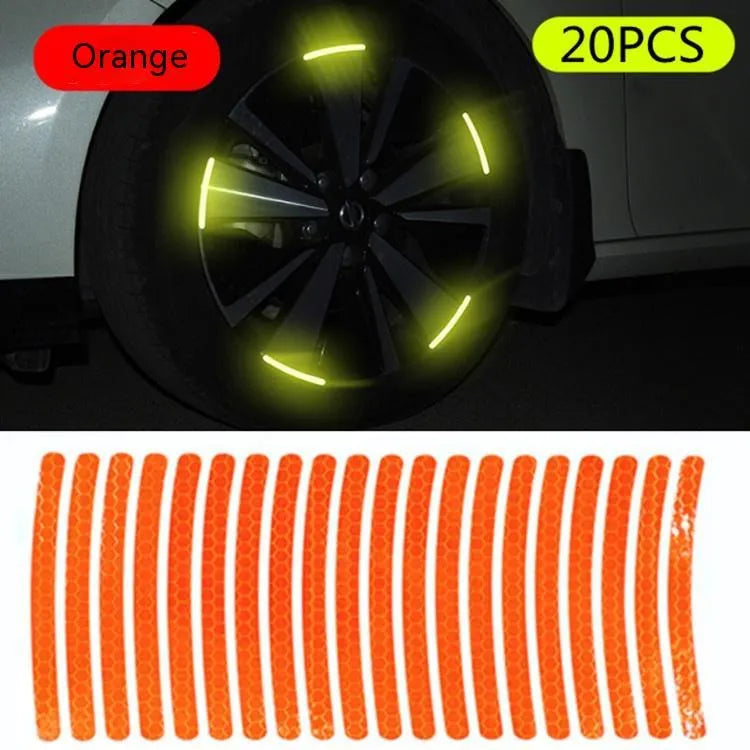 Pack of 20 arc-shaped PVC reflective stickers for car wheel hubs in assorted high-visibility colours.