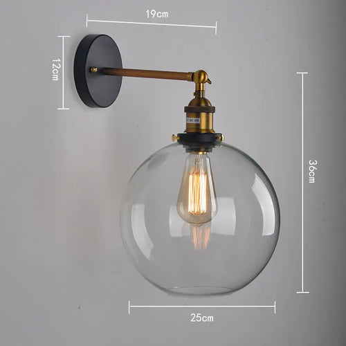 20cm round retro glass wall lamp in amber colour with aluminium holder on a white wall.