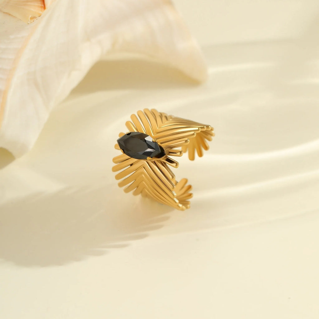 Geometric titanium steel ring with inlaid zircon stones on a finger, showing open mouth adjustable design.