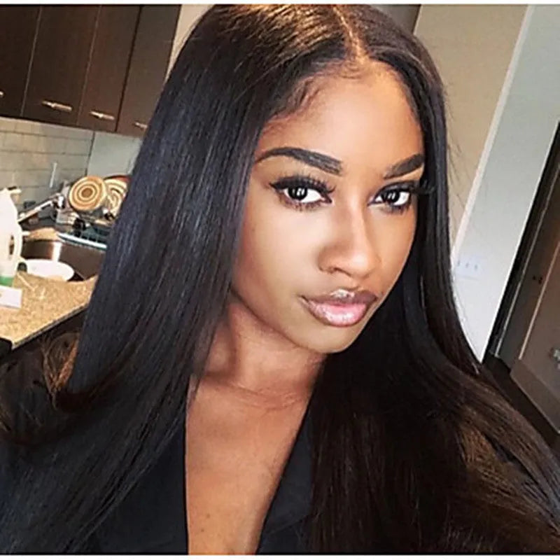 Long straight black wig with centre-parted bangs on wig stand