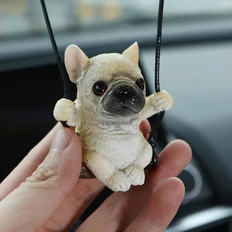 Resin cartoon bulldog car hanging ornament for a rearview mirror in various colours.
