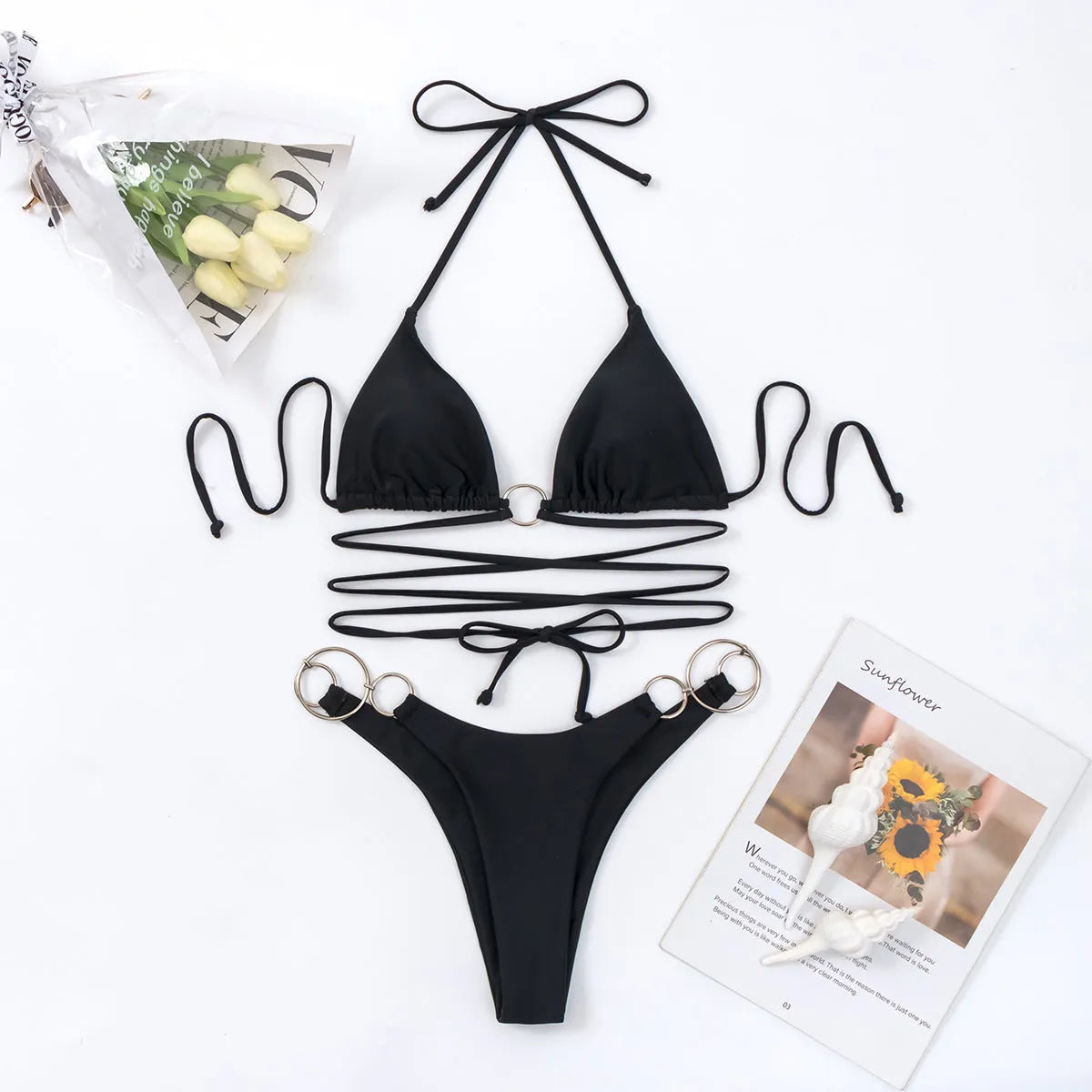 Black women's bikini set with long straps and metal rings, backless sleeveless design.