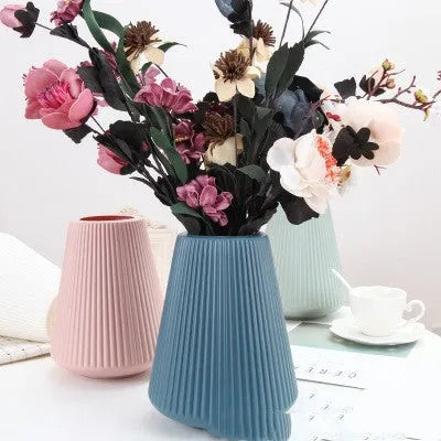 Colourful melamine plastic flower vase in blue, green, pink, or white, measuring 16 cm by 20 cm.